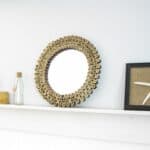 Make a sunburst mirror using bamboo fencing.