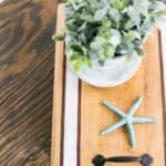 Striped wood tray with handles.