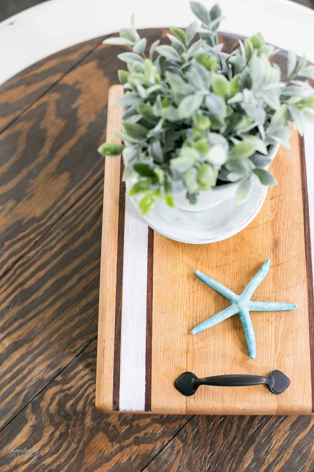 Striped wood tray with handles.