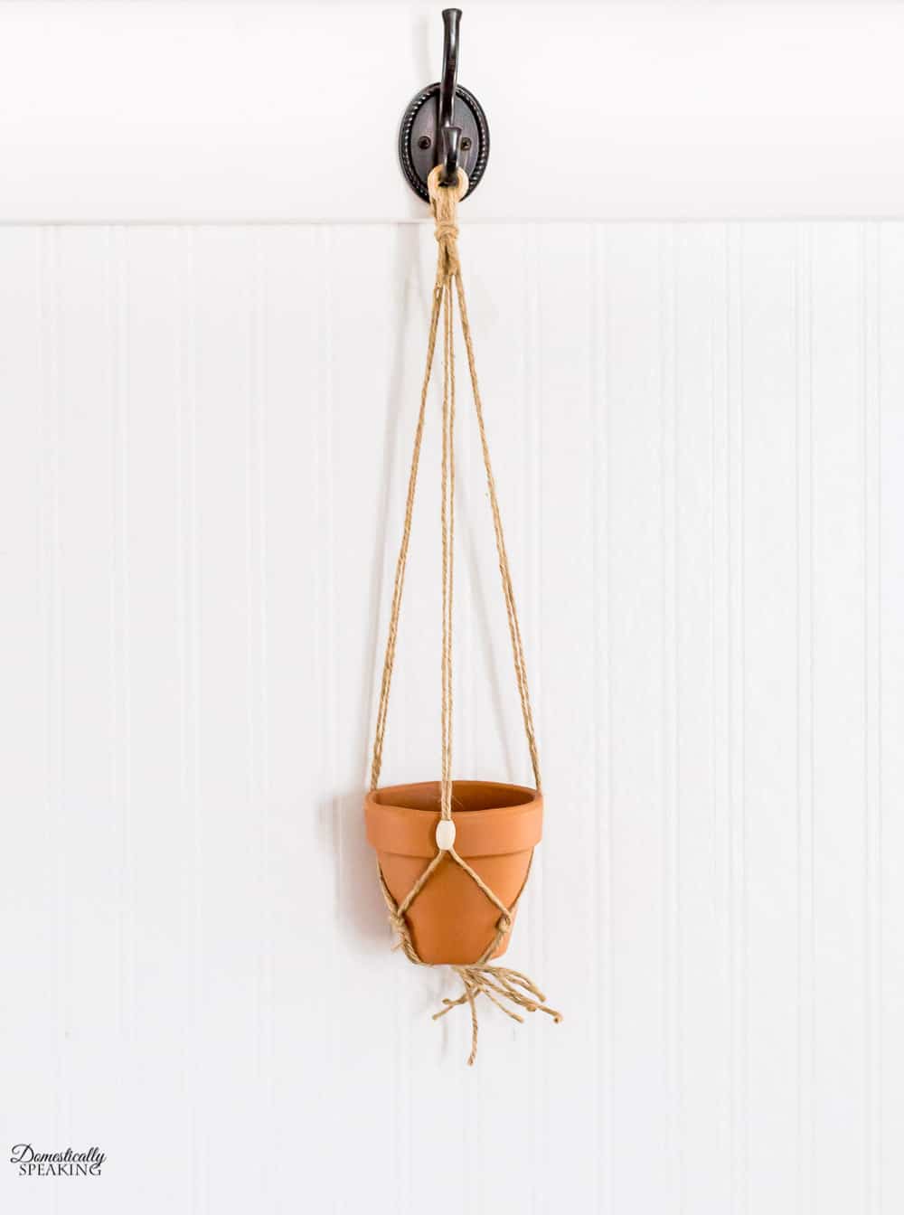 Add pot to macrame hanger