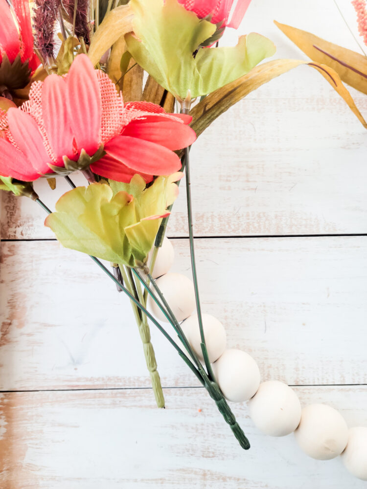 attaching sunflowers to wreath