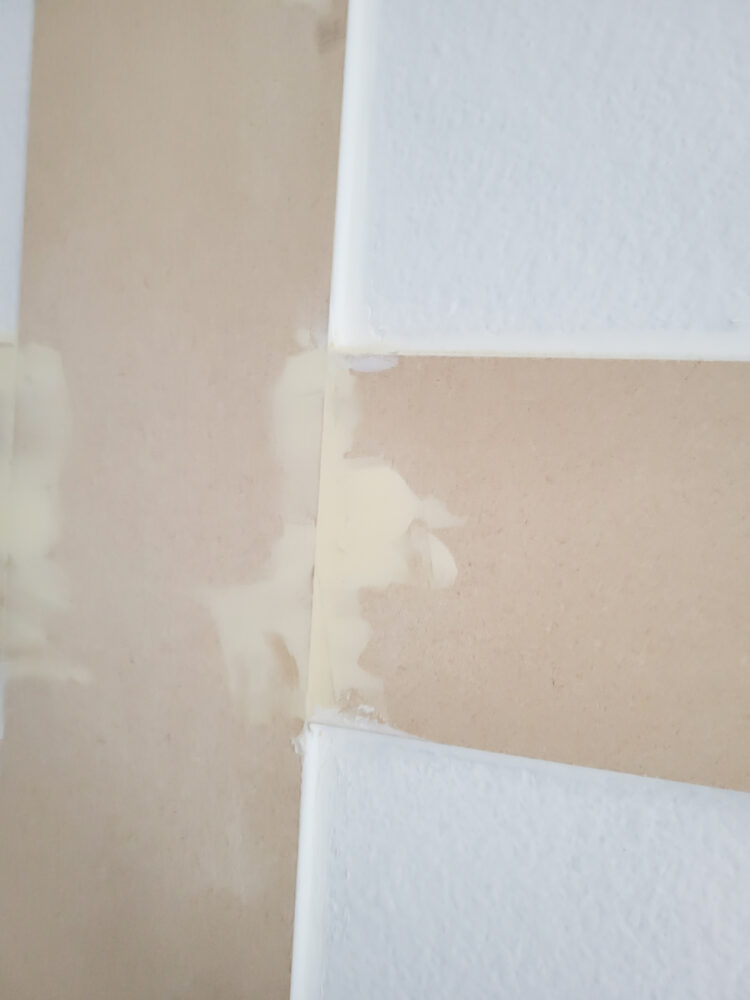 Putting wood filler on the seams between the bender boards.